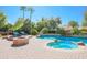 Stunning pool and spa with fire pit and lush landscaping at 17808 N 57Th Pl, Scottsdale, AZ 85254