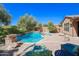 Lush backyard oasis with inviting pool, spa, and patio seating at 17808 N 57Th Pl, Scottsdale, AZ 85254