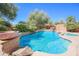 Stunning pool with waterfall feature and spacious patio at 17808 N 57Th Pl, Scottsdale, AZ 85254
