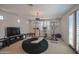 Upstairs loft with home gym equipment and comfortable seating at 17808 N 57Th Pl, Scottsdale, AZ 85254