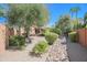 Landscaped backyard with a pathway and desert landscaping at 17808 N 57Th Pl, Scottsdale, AZ 85254