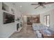 Living area with hardwood floors, fireplace and open kitchen concept at 17808 N 57Th Pl, Scottsdale, AZ 85254