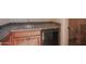 Basement wet bar with sink, mini fridge, and toilet at 17808 N 57Th Pl, Scottsdale, AZ 85254