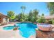 Expansive pool and spa with a fire pit and beautiful landscaping at 17808 N 57Th Pl, Scottsdale, AZ 85254