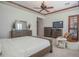 Spacious Primary bedroom with large bed, dresser, and TV at 17808 N 57Th Pl, Scottsdale, AZ 85254