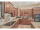 Well-equipped kitchen showcasing granite countertops and rich wood cabinets at 17808 N 57Th Pl, Scottsdale, AZ 85254