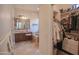 Bathroom with vanity, soaking tub, and walk-in closet at 17808 N 57Th Pl, Scottsdale, AZ 85254