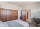 Bright bedroom with built-in workspace and closet at 17808 N 57Th Pl, Scottsdale, AZ 85254