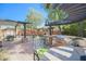 Large patio with multiple seating areas and a built-in grill at 17808 N 57Th Pl, Scottsdale, AZ 85254