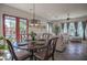 Cozy dining space with a charming wooden table and access to patio at 17808 N 57Th Pl, Scottsdale, AZ 85254