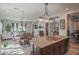Kitchen with island, sink, and view into Gathering and dining areas at 17808 N 57Th Pl, Scottsdale, AZ 85254