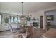 Elegant dining area with a round wooden table and seating for four at 17808 N 57Th Pl, Scottsdale, AZ 85254