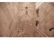 Large walk in shower with tile surround and built in shelves at 17808 N 57Th Pl, Scottsdale, AZ 85254