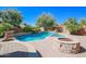 Resort-style pool and spa with fire pit and expansive patio at 17808 N 57Th Pl, Scottsdale, AZ 85254