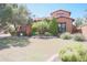 Two-story house with manicured lawn and landscaping at 17808 N 57Th Pl, Scottsdale, AZ 85254