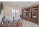 Home office with large desk, built in shelving, and computer at 17808 N 57Th Pl, Scottsdale, AZ 85254