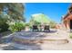 Private patio with seating area and umbrella at 17808 N 57Th Pl, Scottsdale, AZ 85254