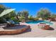 Relaxing pool and spa area with lounge chairs and fire pit at 17808 N 57Th Pl, Scottsdale, AZ 85254