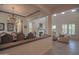 Open dining room with a large table, chandelier, and view to living room at 17808 N 57Th Pl, Scottsdale, AZ 85254