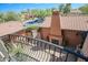 Balcony overlooking the courtyard and outdoor fireplace at 17808 N 57Th Pl, Scottsdale, AZ 85254