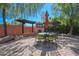 Outdoor patio with pergola, fireplace, and seating at 17808 N 57Th Pl, Scottsdale, AZ 85254