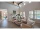 Spacious living room with high ceilings, exposed beams, and comfortable seating at 17808 N 57Th Pl, Scottsdale, AZ 85254
