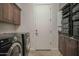 Spacious laundry room with washer, dryer, and ample storage at 17808 N 57Th Pl, Scottsdale, AZ 85254