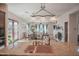 Bright dining room with wood table and chairs, adjacent to kitchen at 17808 N 57Th Pl, Scottsdale, AZ 85254