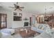 Spacious living room with a fireplace and access to the backyard at 17808 N 57Th Pl, Scottsdale, AZ 85254