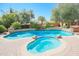 Luxury pool and spa with waterfall and spa features at 17808 N 57Th Pl, Scottsdale, AZ 85254