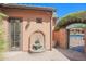 Water fountain and gated entry to the courtyard at 17808 N 57Th Pl, Scottsdale, AZ 85254