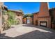 Outdoor fireplace and seating area in a brick courtyard at 17808 N 57Th Pl, Scottsdale, AZ 85254