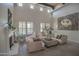 Spacious living room featuring high ceilings, tiled floors, and a cozy seating area at 17808 N 57Th Pl, Scottsdale, AZ 85254