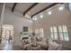 Spacious living room with high ceilings, exposed beams, and comfortable seating at 17808 N 57Th Pl, Scottsdale, AZ 85254