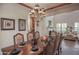 Open dining room with a large table and chandelier, view to living room at 17808 N 57Th Pl, Scottsdale, AZ 85254