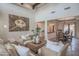 Spacious living room with high ceilings, exposed beams, and comfortable seating at 17808 N 57Th Pl, Scottsdale, AZ 85254