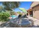 Relaxing patio with seating area and shade umbrella at 17808 N 57Th Pl, Scottsdale, AZ 85254