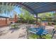 Outdoor patio with dining and seating areas under pergola at 17808 N 57Th Pl, Scottsdale, AZ 85254