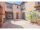 Brick courtyard with fireplace and decorative statues at 17808 N 57Th Pl, Scottsdale, AZ 85254