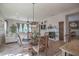 Open dining area with a wooden table and chairs near kitchen at 17808 N 57Th Pl, Scottsdale, AZ 85254