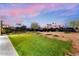 Grass lawn and patio area with a view of golf course at 6311 E Phoenician Blvd # 21, Scottsdale, AZ 85251