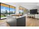 Modern kitchen island with stainless steel appliances and breakfast bar at 6311 E Phoenician Blvd # 21, Scottsdale, AZ 85251