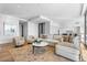 Comfortable living room with sectional sofa, large windows, and access to kitchen at 6311 E Phoenician Blvd # 21, Scottsdale, AZ 85251