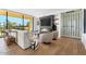 Elegant living room featuring a fireplace, wine storage, and ample natural light at 6311 E Phoenician Blvd # 21, Scottsdale, AZ 85251