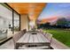 Patio with large dining table and built-in grill at 6311 E Phoenician Blvd # 21, Scottsdale, AZ 85251