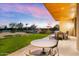 Evening view of patio with seating and golf course view at 6311 E Phoenician Blvd # 21, Scottsdale, AZ 85251
