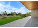 Covered patio with golf course views and wood ceilings at 6311 E Phoenician Blvd # 21, Scottsdale, AZ 85251