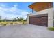 Attached garage with wood-like finish and golf course view at 6311 E Phoenician Blvd # 21, Scottsdale, AZ 85251