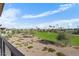 View of a lush green golf course from a balcony at 6311 E Phoenician Blvd # 21, Scottsdale, AZ 85251
