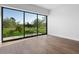 Bright bedroom with hardwood floors and sliding glass doors to a patio at 6311 E Phoenician Blvd # 21, Scottsdale, AZ 85251